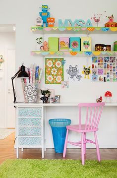 a child's room with toys on the shelves and colorful furniture in the corner