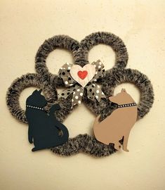 a pair of scissors decorated with dogs and hearts