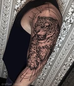 a person with a tattoo on their arm and the image of a tiger is shown