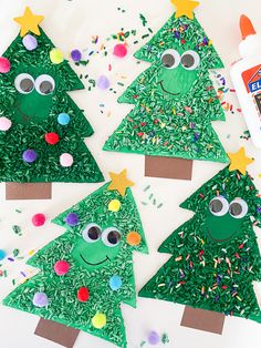 paper plate christmas trees with googly eyes and sprinkles