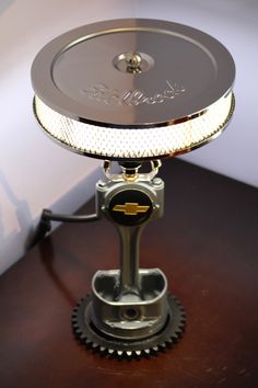 a table lamp that is on top of a wooden table