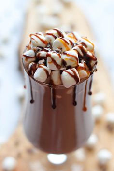 a chocolate dessert with marshmallows and caramel drizzle