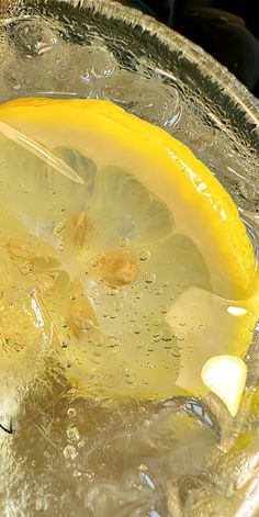 a glass bowl filled with liquid and a banana