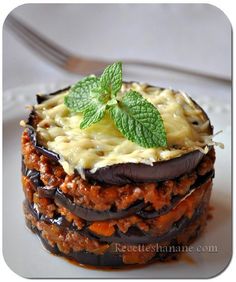 an image of a dessert with chocolate and cheese on it's crusts, topped with fresh mint leaves