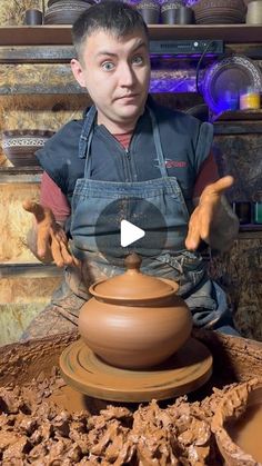 a man is making a clay pot with his hands