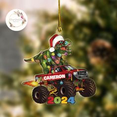 a christmas ornament with a monster truck on it