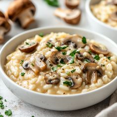 a bowl filled with mushroom riso and garnished with parsley on the side