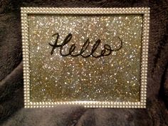 the name hello written in glitter on a blanket