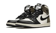 The Air Jordan 1 “Dark Mocha” progresses the timeless silhouette’s association with wearable earth tones.  Inspiration for the “Dark Mocha,” a Fall 2020 release, is culled from one of the most popular sneaker collaborations of 2019—Travis Scott’s Air Jordan 1 collection.  Though unlike the rapper’s take on the Jordan 1, this “Dark Mocha” iteration features smooth black leather overlays on the forefoot, eyelets, and toe cap.  White leather appears on the mid-panel, collar, and perforated toe.  Cl Jordan 1 Dark Mocha, Jordan 1 Mocha, Nike Essentials, Popular Sneakers, Jordan 1 High Og, Jordan Sneakers, Air Jordan 1 Retro High Og, Nike Dunk High, Air Jordan 1 Retro High