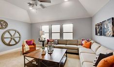 a living room filled with furniture and a chandelier