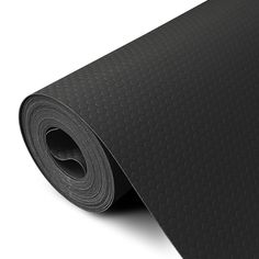 a black yoga mat on a white background