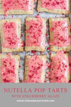 nutella pop tarts with strawberry glaze are on a baking sheet and ready to be eaten