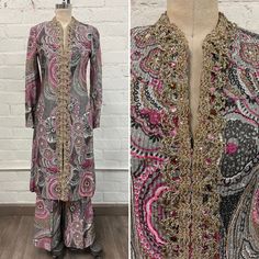 "Incredible rare vintage late 60s or 70s metallic dress tunic and pant set. This is made from an incredible textured metallic fabric with a gorgeous mod paisley print allover, and the neckline is heavily jeweled with metallic braiding and stones. The dress and pants can be worn individually or together to mix up the looks! Absolutely stunning and eye catching! The set is in excellent condition, there are some loose threads on the trimming, but overall it's excellent. Best fits an XS. Chest: 32.5\" Waist: 28\" Hip: 38\" Dress Length: 40\"  Pant Waist: 24\" max  Inseam: 28\"  Front rise: 13.25\" #dress #tunic #top #paisley #longsleeve #metallic #boho #60s #70s #beaded #mod #set #pants #silver #pink" Elegant Sequin Palazzo Set For Spring, Festive Bohemian Paisley Print Sets, Festive Paisley Print Sets, Spring Silk Fitted Palazzo Set, Fitted Silk Palazzo Set For Spring, Pink Bohemian Palazzo Set For Party, Bohemian Long Sleeve Palazzo Set For Party, Glamorous Fitted Palazzo Set For Evening, Bohemian Long Party Sets