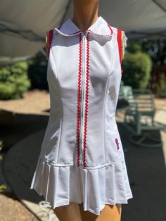 Here is a vintage 1970s Fashion T brand polyester tennis dress .No size.Following are the measurements.Bust 34",Waist 30",Hips 38",Length measured from top of shoulder to hem 29"long.Zips up the front.Made out of white polyester fabric.Zig zag red trim.Nice vintage condition.Please take special consideration of measurements. 1970s sizing was much smaller than today's standards.Tennis dresses were very short not like a regular dress. So please take special note of length.If you live overseas plea Fitted White Tennis Dress With Short Sleeves, Fitted Cotton Tennis Dress, Fitted Cotton Tennis Dress For Spring, 70s Sports Fashion, 70s Mode, Tennis Dresses, 60s And 70s Fashion, Seventies Fashion, Trim Fabric