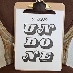 a clipboard with the words i am ugly do type on it