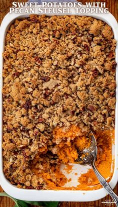 sweet potato casserole with pecan streuse topping in a white dish