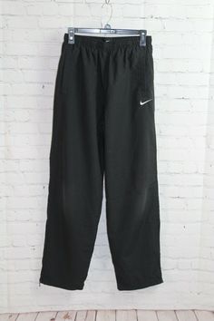 Nike Preowned Women's Athletic Pant/Joggers Size:  Medium Color:  Black MEASUREMENTS TAKEN WITH ITEM LYING FLAT, NOT STRETCHED, AND IS APPROXIMATE! WAIST:  26" RISE:  12" INSEAM:  31" **** MACHINE WASH **** 100% Polyester *** As a policy, we do NOT accept returns *** Due to recent scamming issues, some items have been discreetly marked * PLEASE READ CAREFULLY * We try our best to accurately describe all of the items in our shop, some of which are consignment.   All measurements taken with item l Black Joggers, Black Side, Athletic Pants, Nike Pants, Pants Black, Athletic Women, Side Zip, Black Pants, Jogging