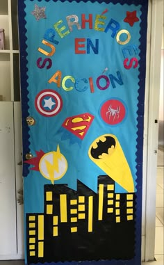 a door decorated with superheros and the words super hero in action on blue paper