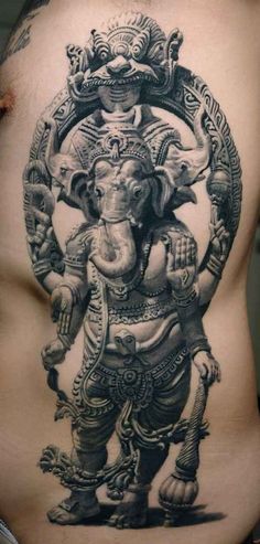 an elephant tattoo on the back of a man's stomach