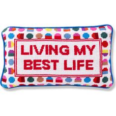 a cross stitch pillow that says living my best life