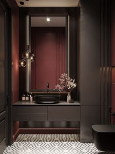 a bathroom with a black sink and red walls