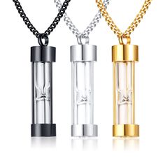 three different necklaces that are attached to each other, one has a glass tube and the other has a gold plated chain