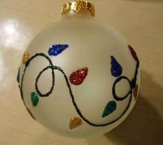 a white ornament with colorful designs on it