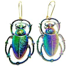 two colorful beetle shaped earrings on top of each other