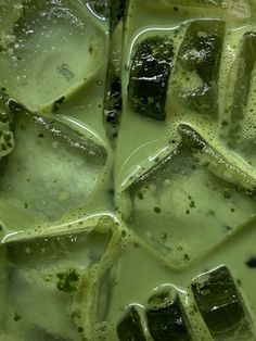 some ice cubes with green liquid on them