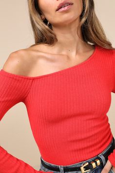 Keep serving the best 'fits on the daily with the Lulus Popular Babe Red Ribbed Knit Asymmetrical Long Sleeve Top! Stretchy ribbed knit shapes this chic little top with an asymmetrical, off-the-shoulder neckline and a fitted bodice, all framed by long sleeves. Pairs perfectly with your fave bottoms for an effortlessly cool 'fit! Fit: This garment fits true to size. Length: Size medium measures 21" from shoulder to hem. Bust: Great for any cup size. Waist: Fitted - stretchy fabric allows custom fit. Undergarments: May be worn with a strapless bra, adhesive bra, petals, or no bra. Fabric: Fabric is very stretchy. Unlined. 45% Rayon, 26% Polyester, 20% Nylon, 9% Spandex. Hand Wash Cold. Do Not Bleach. Line Dry. Iron Low Heat. Imported. Lulus | Popular Babe Red Ribbed Knit Asymmetrical Long Sl Trendy Ribbed Tops For Night Out, Ribbed Stretch Top For Party, Stretch Ribbed Top For Party, Stretch Ribbed Party Top, Chic Asymmetrical Ribbed Top, Asymmetrical Ribbed Stretch Top, Ribbed Fitted Top For Night Out, Ribbed Tops For Night Out In Spring, Stretch Ribbed Knit Top For Party