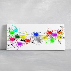 colorful music notes with paint splatters on white canvas wall art print by design express