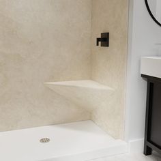 a bathroom with a sink, mirror and bathtub next to a wall mounted shower head