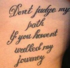 the back of a woman's stomach with an inscription on it that reads, don't judge my path if