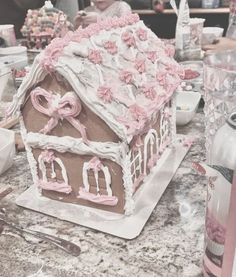 a cake shaped like a house sitting on top of a table