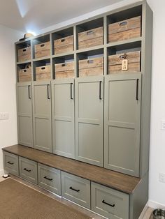 a room with many drawers and bins on the wall