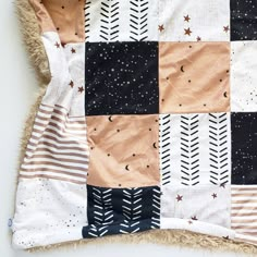 a blanket with stars and arrows on it