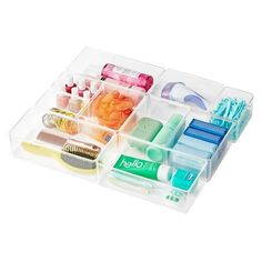 the container is filled with various items such as toothbrushes, combs and other things