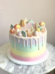 there is a cake that has been decorated with candy and marshmallows