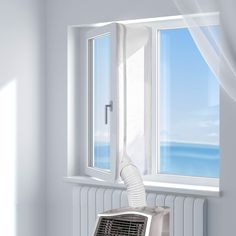 an air conditioner sitting on top of a window sill next to a radiator