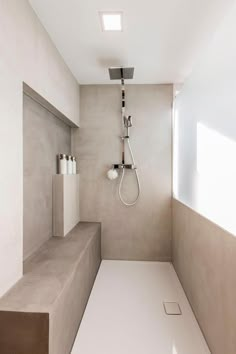 a bathroom with concrete walls and flooring