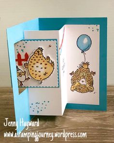 a handmade birthday card with an image of a hedge and a bird holding a balloon