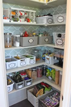 an organized pantry with bins and baskets