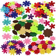 colorful felt flowers and leaves on a white background