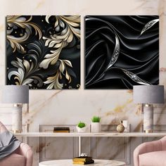 two black and gold paintings in a living room