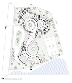 an architectural drawing shows the ground plan for a circular house, which is surrounded by trees and