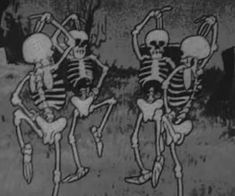 three skeletons are dancing in the woods