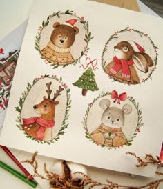 four christmas cards on top of each other with animals in the center and wreaths around them