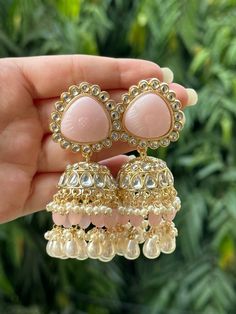 Beautiful engraved Jhumka earrings available in 2 stunning variations of pink. These earrings are high quality and are made to last. They are not too heavy and will be fine to wear all day long. They surely add a statement to any look! In case of any queries, please feel free to reach out. Happy shopping! Luxury White Jhumkas With Latkans, Luxury Tilla Jhumkas For Eid, Luxury Fusion Style Chandelier Earrings With Latkans, Luxury Hallmarked Fusion Jhumkas, Luxury Jhumkas With Intricate Design For Anniversary, Cheap Jhumkas For Diwali Celebration, Luxury Jhumkas With Stone Work For Festivals, Luxury Ornate Jhumkas For Festivals, Luxury Hand Set Jhumkas For Diwali