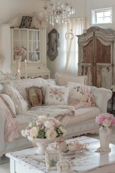 a living room filled with furniture and flowers