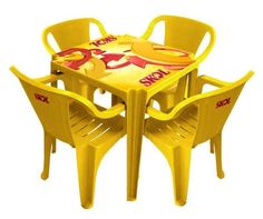 a yellow plastic table and four chairs with the word now painted on it's sides